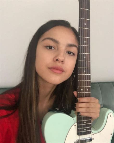 Olivia Rodrigo on Instagram: “hi! me, my favorite red robe, and my guitar just popping in to ...