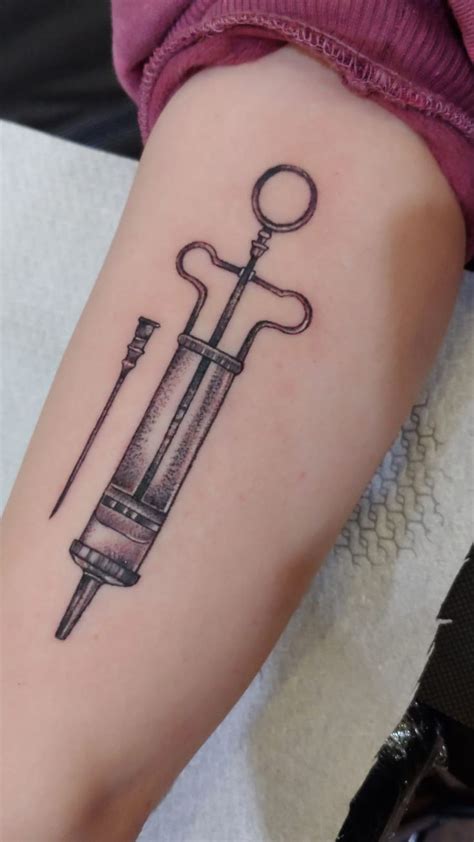 My upper arm antique syringe tattoo done by Yulia at Art Magic Tattoo Israel. Super happy with ...