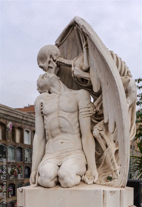 The Kiss of Death statue in Poblenou Cemetery in Barcelona. This marble sculpture depicts death ...