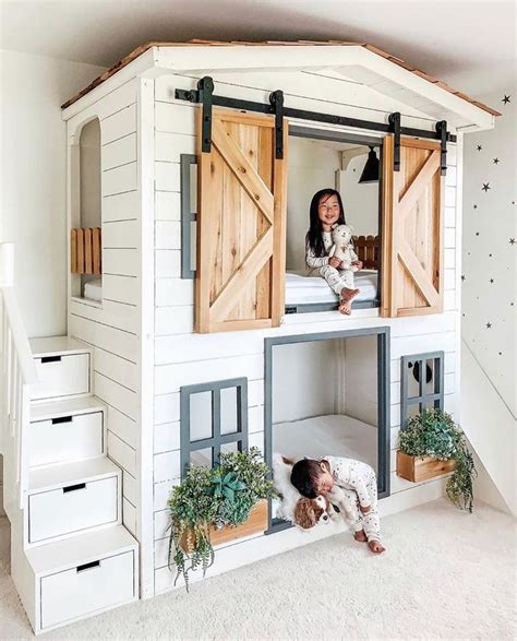 This bunk bed is adorable! Love the barn door, storage in the steps ...