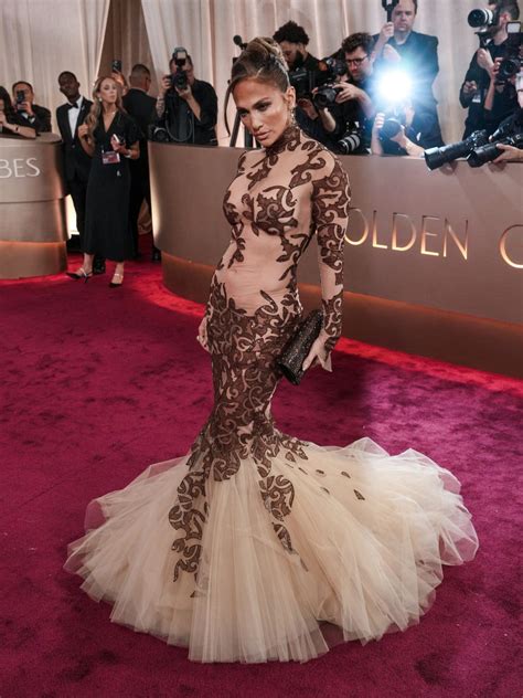 Jennifer Lawrence and Jennifer Lopez turn heads in nude gowns at Golden