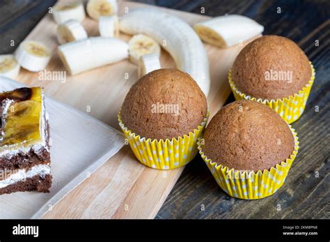 delicious wheat cupcakes on a black wooden table , fresh homemade