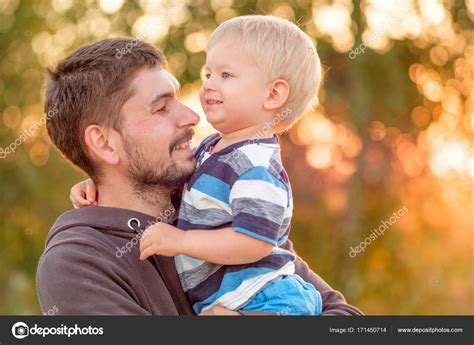 Man holding child on hands Stock Photo by ©haveseen 171450714