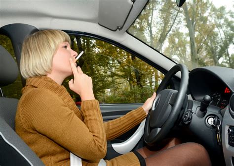blonde woman smoking cigarette  car stock photo  image