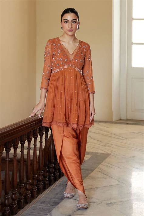 nimbus hand embroidered peplum kurta  dhoti pant set orange salli