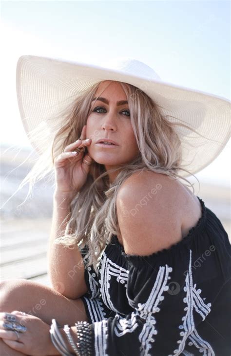 Beautiful Blonde Haired Woman Dressed In Bohemian Style At The Beach