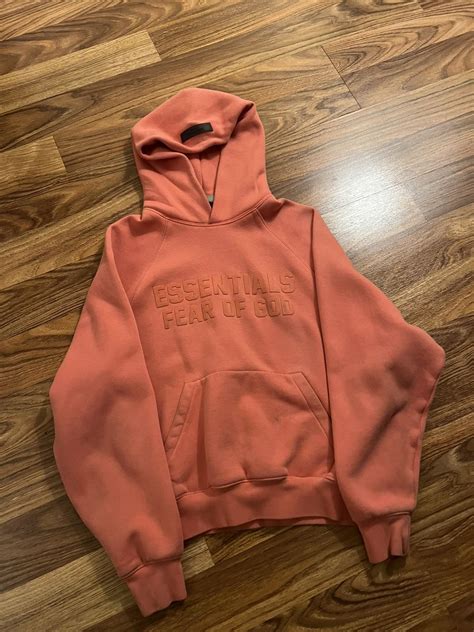 Fear of God Essentials “Coral” Pink Hoodie | Grailed