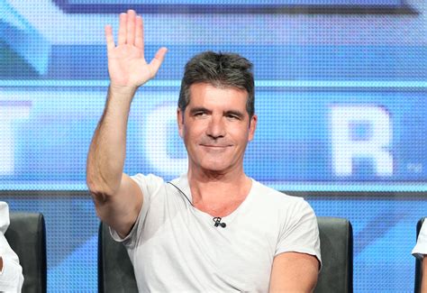 Is Simon Cowell's Approach To Fatherhood Revolutionary? Experts Weigh In. Image 12
