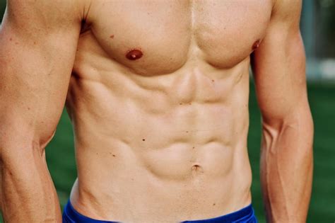 Premium Photo | Midsection of shirtless man 