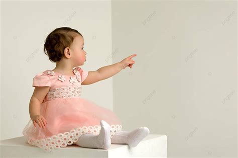 girl points   finger showing child  photo background