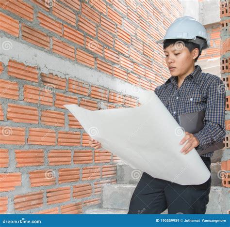 Asian Managers Of Engineer Architects Wear White Helmet Safety On