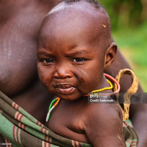 Portrait Of African Baby From Mursi Tribe Ethiopia Africa High-Res ...