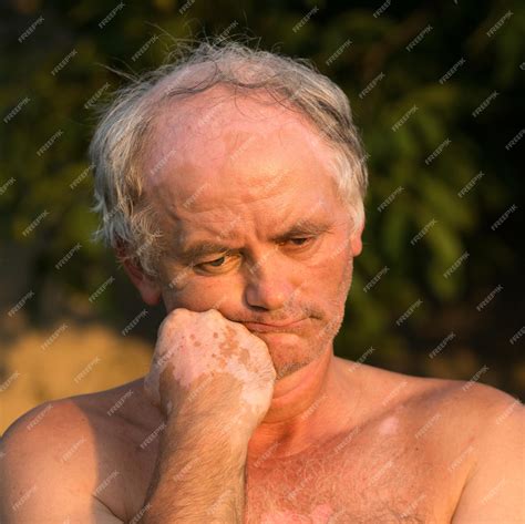 Premium Photo | Portrait of naked man on natural background