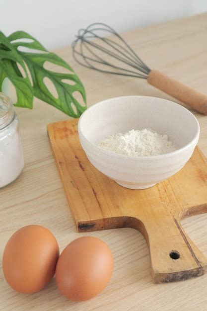 Premium Photo | Flour on the table with an egg