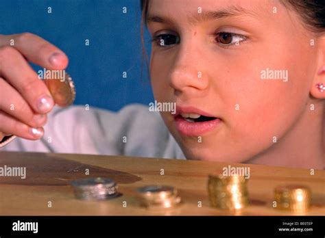 portrait   young girl counting  saved money stock photo alamy