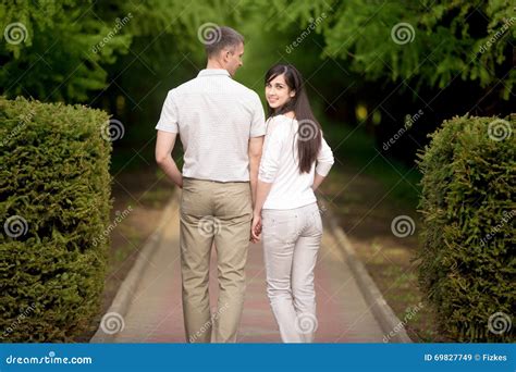 Young Man and Woman Walking Outdoor Stock Image - Image of affection