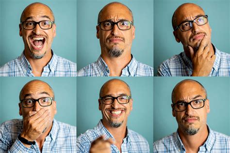 Download A Man In Glasses Is Making Different Faces | Wallpapers.com