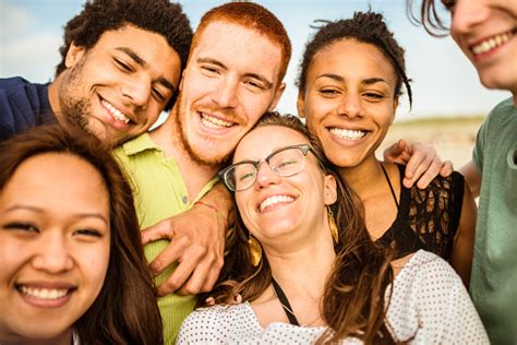 Group Of Friends Laughing And Doing A Selfie Stock Photo - Download