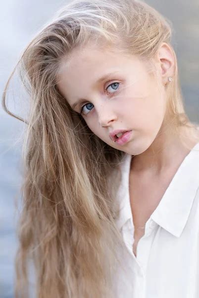 Portrait of little girl outdoors in summer — Stock Photo © zagorodnaya ... 
