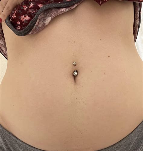 Is my belly button piercing too shallow? I got it 10 months ago! : r