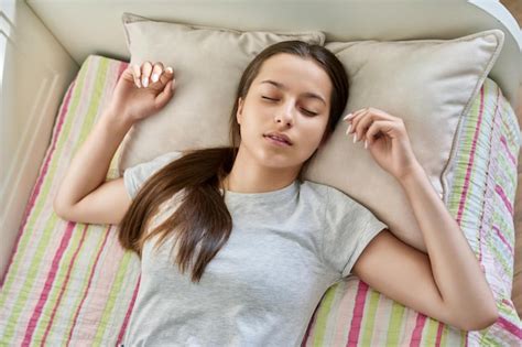 Premium Photo | Teenage girl sleeping at home in bed daytime sleep calm ...