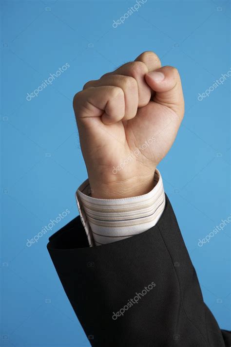man raising  hand stock photo eskaylim