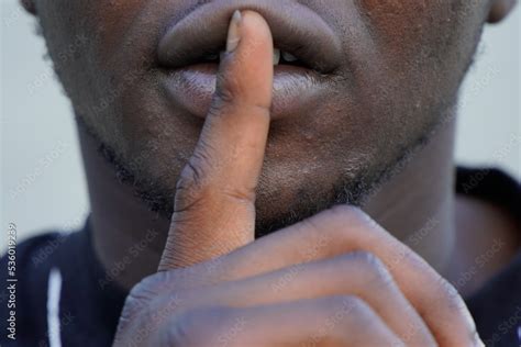 silence sign. unrecognizable black male portrait. Victim of racism ...