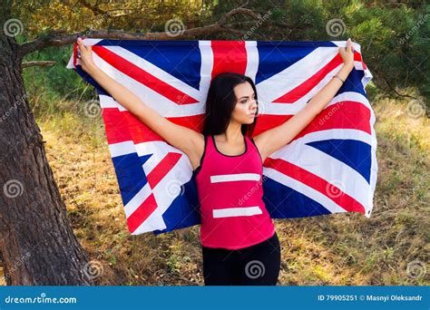 Young Beautiful Brunette Girl Posing with a British Flag in Autumn Park ...