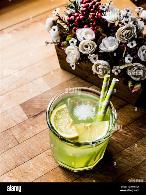 Midori Sour Cocktail with ice and lemon. Beverage Concept Stock Photo ...