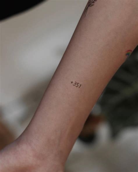 Portugal country code "+351" tattoo located on the