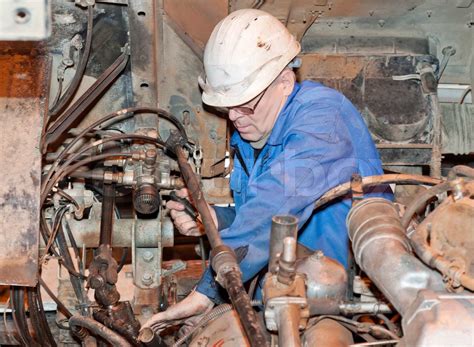 the mechanic serves mechanisms | Stock image | Colourbox