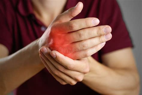 guy hurts  hand  pain   fist closeup stock image