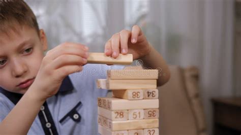 Close-up of Little Kids Playing Board Game with Wooden Blocks, Jenga ...
