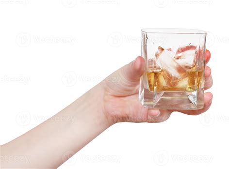 hand holds glass with whiskey isolated 11845823 Stock Photo at Vecteezy