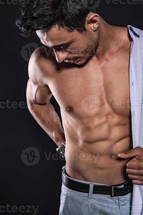 Handsome Arab male model with perfect body posing in studio. Portrait