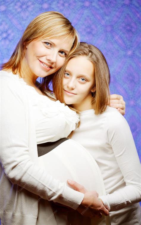 Premium Photo | Pregnant woman with daughter