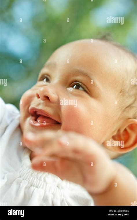 baby smiling  playing stock photo alamy