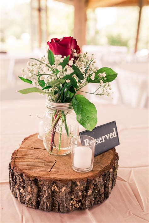 rustic mason jar wedding centerpiece  red roses  greenery