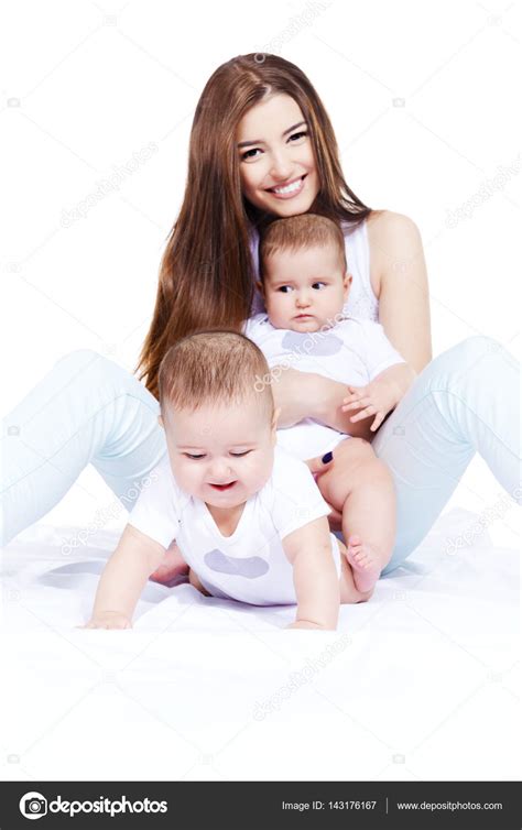Adorable mother. Healthy children. Isolated over white. — Stock Photo ...