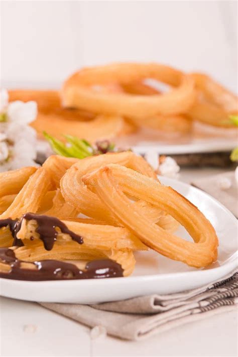 Churros with Chocolate Dipping Sauce. Stock Photo - Image of churros ...