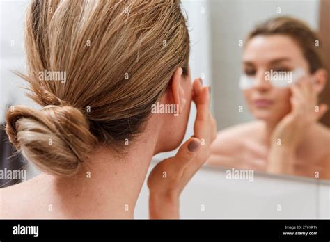 Eye bags treatment blurred mirror reflection Stock Photo - Alamy