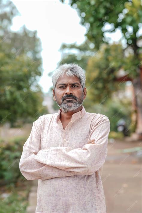 Premium Photo | Indian old man giving expression on nature background