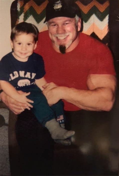 Baby Bronson steiner, sitting on the lap of his uncle scott Steiner