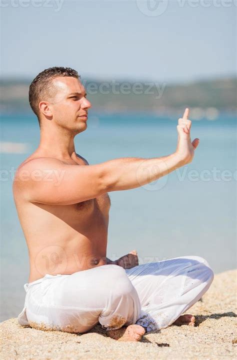 Meditation on the beach 14227189 Stock Photo at Vecteezy
