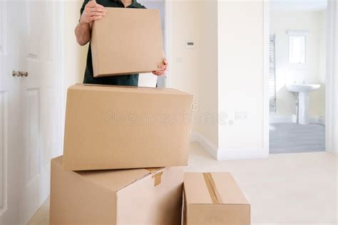close   removal man carrying boxes   home  moving day
