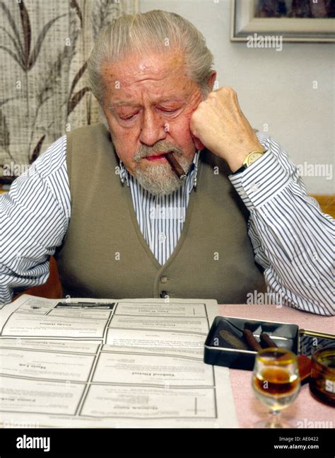Old man reading death notices Stock Photo - Alamy