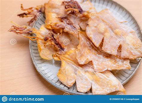 Dried squid snack in plate stock photo. Image of cuttlefish - 255693146