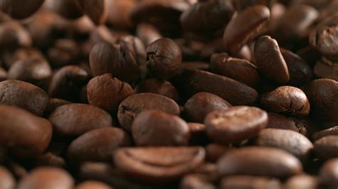 Roasted coffee beans 21714610 Stock Video at Vecteezy