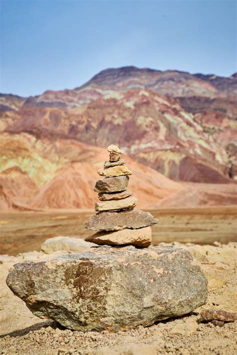 cairn rock stack  front  mountain  colorful layers stock photo