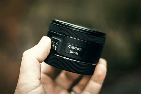 hand holding camera lens  stock photo